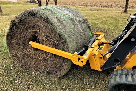 skid steer bale unroller|tow behind round bale unroller.